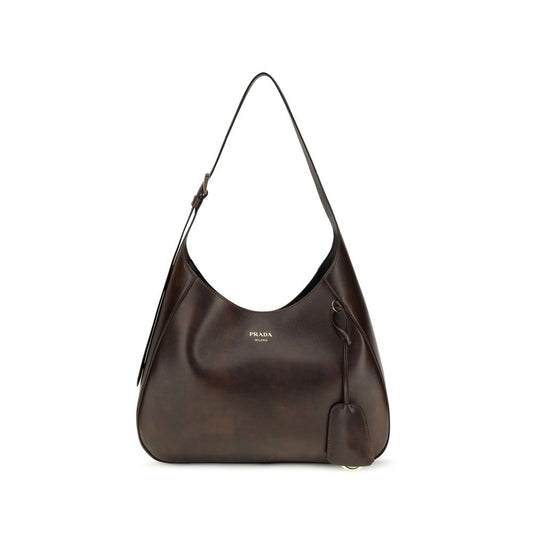 Medium Shoulder Bag by Prada for women in bos taurus calf leather brown features a distinguished silhouette, showcasing a secure zipper & magnetic and distinguished with versatile shoulder-strap, adjustable-strap & handle for a distinguished finish.