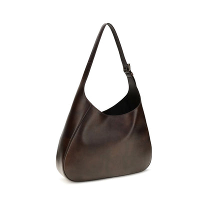 Medium Shoulder Bag by Prada for women in bos taurus calf leather brown features an effortlessly chic silhouette with a secure zipper & magnetic, ample , and versatile shoulder-strap, adjustable-strap & handle for effortlessly chic everyday luxury.