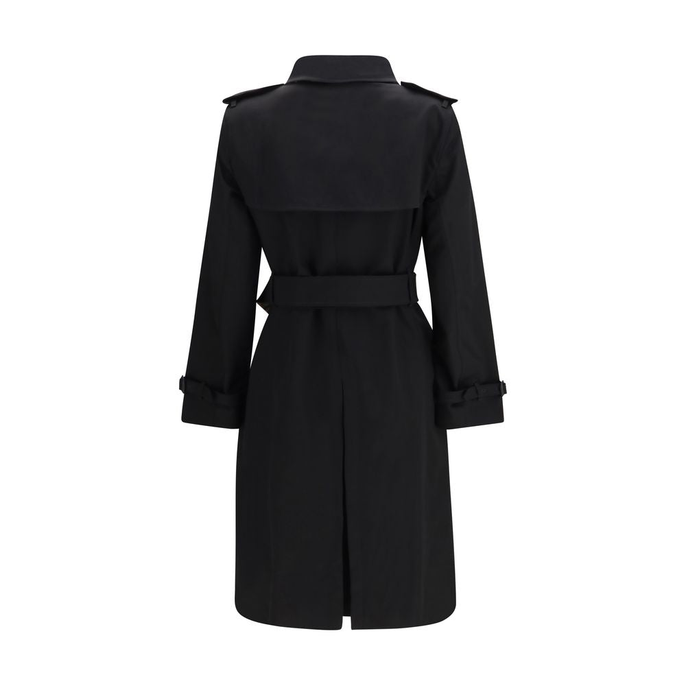 Trench Coat by Burberry for women in cotton beige & black presents a distinguished silhouette, artfully detailed with pockets and a distinguished for a sophisticated, distinguished finish.