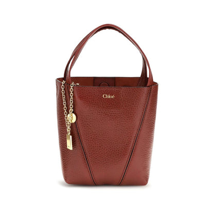 Shoulder Bag by Chloé for women in bos taurus grained leather multicolor & monogram features a effortless chic silhouette with a secure magnetic & button, ample single-compartment, and versatile shoulder-strap, handle & adjustable-strap for a effortless chic finish.