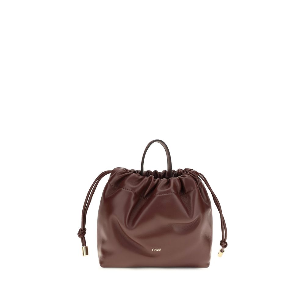 Compact Drawstring Shoulder Bag by Chloé for women in bos taurus nappa leather gold & signature features an effortlessly chic silhouette with a secure drawstring, ample , and versatile shoulder-strap & handle for effortlessly chic everyday luxury.
