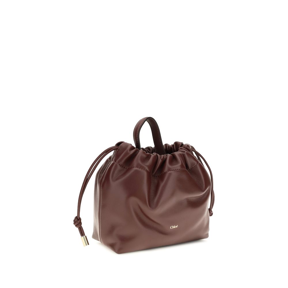 Compact Drawstring Shoulder Bag by Chloé for women in bos taurus nappa leather gold & signature features a effortless chic silhouette with a secure drawstring, ample , and versatile shoulder-strap & handle for a effortless chic finish.
