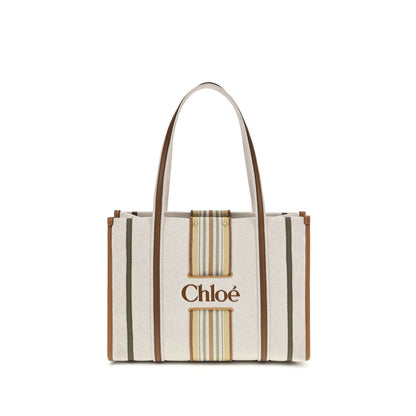 Shoulder Tote Bag by Chloé for women in cotton canvas & calf leather beige & striped presents a versatile silhouette, showcasing a secure magnetic and versatile with versatile shoulder-strap & belt-strap for a sophisticated look.