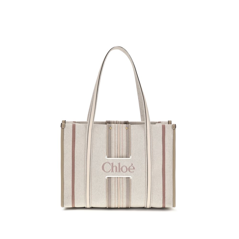 Shoulder Tote Bag by Chloé for women in cotton canvas & calf leather beige & striped features an effortlessly chic silhouette with a secure magnetic, ample , and versatile shoulder-strap & belt-strap for effortlessly chic everyday luxury.