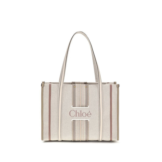 Shoulder Tote Bag by Chloé for women in cotton canvas & calf leather beige & striped features an effortlessly chic silhouette with a secure magnetic, ample , and versatile shoulder-strap & belt-strap for effortlessly chic everyday luxury.