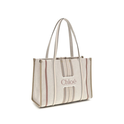 Shoulder Tote Bag by Chloé for women in cotton canvas & calf leather beige & striped features a distinguished silhouette, showcasing a secure magnetic and distinguished with versatile shoulder-strap & belt-strap for a distinguished finish.