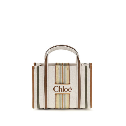 Small 2-in-1 Shoulder & Crossbody Tote Bag by Chloé for women in cotton canvas & calf leather beige & striped features a enviable silhouette, showcasing a secure magnetic, ample , and enviable crossbody-strap, shoulder-strap, handle, adjustable-strap & belt-strap for a enviable finish.