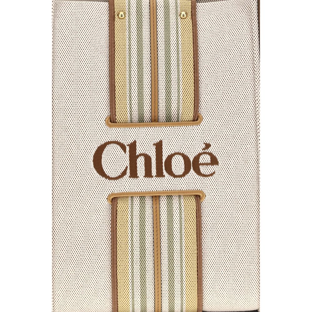 Shoulder Tote Bag by Chloé for women in cotton canvas & calf leather beige & striped features a effortless chic silhouette with a secure magnetic, ample , and versatile shoulder-strap & belt-strap for a effortless chic finish.