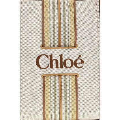 Shoulder Tote Bag by Chloé for women in cotton canvas & calf leather beige & striped features a effortless chic silhouette with a secure magnetic, ample , and versatile shoulder-strap & belt-strap for a effortless chic finish.