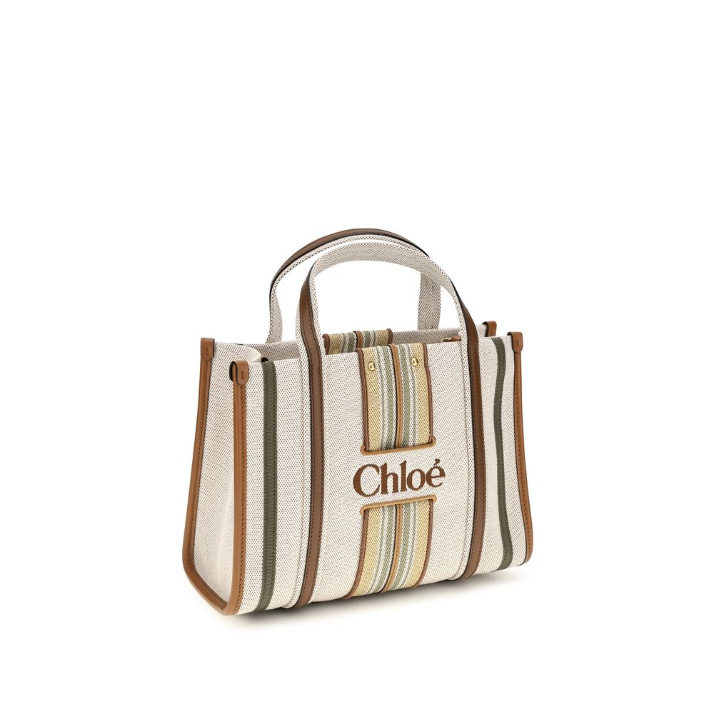 Small 2-in-1 Shoulder & Crossbody Tote Bag by Chloé for women in cotton canvas & calf leather beige & striped features a effortless chic silhouette with a secure magnetic, ample , and versatile crossbody-strap, shoulder-strap, handle, adjustable-strap & belt-strap for a effortless chic finish.