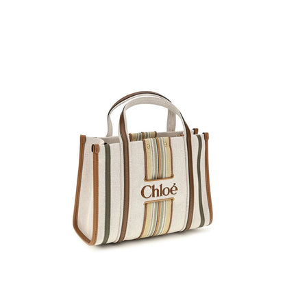 Small 2-in-1 Shoulder & Crossbody Tote Bag by Chloé for women in cotton canvas & calf leather beige & striped features a effortless chic silhouette with a secure magnetic, ample , and versatile crossbody-strap, shoulder-strap, handle, adjustable-strap & belt-strap for a effortless chic finish.