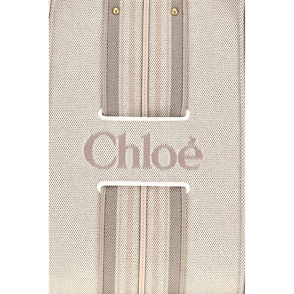 Shoulder Tote Bag by Chloé for women in cotton canvas & calf leather beige & striped showcases a enviable silhouette, artfully detailed with a secure magnetic, organized , and versatile shoulder-strap & belt-strap for a enviable look.