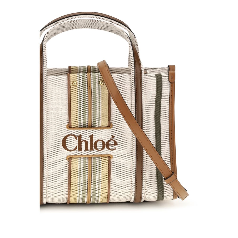 Small 2-in-1 Shoulder & Crossbody Tote Bag by Chloé for women in cotton canvas & calf leather beige & striped features a effortless sophistication silhouette, secured by a magnetic with ample and versatile crossbody-strap, shoulder-strap, handle, adjustable-strap & belt-strap for a effortless sophistication finish.