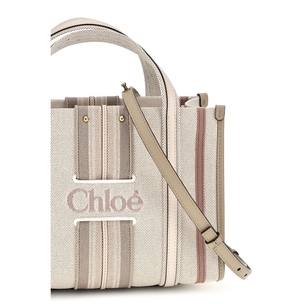 Small 2-in-1 Shoulder & Crossbody Tote Bag by Chloé for women in cotton canvas & calf leather beige & striped features a distinguished silhouette, showcasing a secure magnetic and distinguished with versatile crossbody-strap, shoulder-strap, handle, adjustable-strap & belt-strap for a distinguished finish.