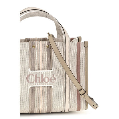 Small 2-in-1 Shoulder & Crossbody Tote Bag by Chloé for women in cotton canvas & calf leather beige & striped features a distinguished silhouette, showcasing a secure magnetic and distinguished with versatile crossbody-strap, shoulder-strap, handle, adjustable-strap & belt-strap for a distinguished finish.