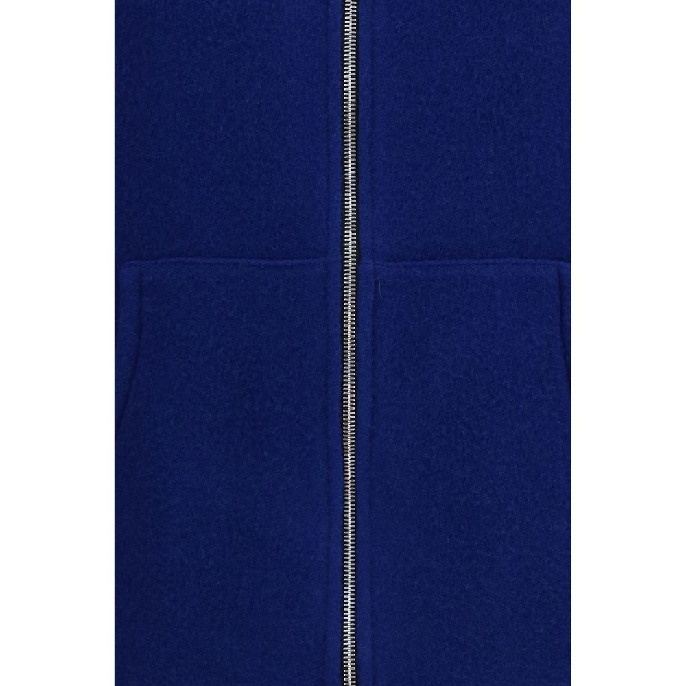 Vest by RIER for women in virgin wool blue showcases a utilitarian silhouette, artfully incorporating pockets and a utilitarian for a truly utilitarian finish.
