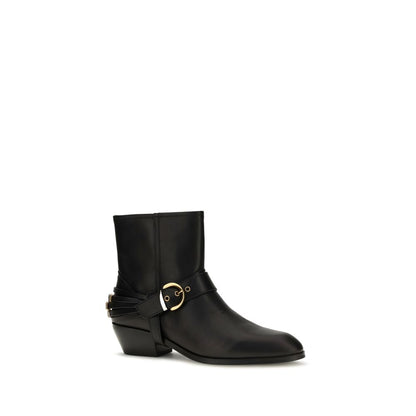 Ankle Strap Boots by PINKO for women in bos taurus calf leather black features an avant-garde Women's Bos Taurus Calf Leather Ankle Strap Boots silhouette, defined by a sophisticated and a avant-garde oval toe style.