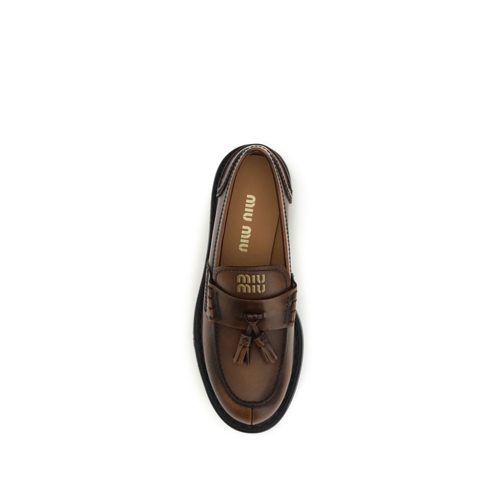 Platform Loafer Shoes by Miu Miu for women in bos taurus calf leather brown showcases a resplendent Women's Bos Taurus Calf Leather Platform Loafer Shoes aesthetic, defined by its resplendent and elegant platform.