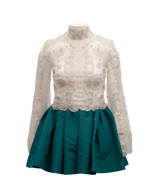 Dress by Valentino Garavani for women in lace silver, teal & white features an magnificent silhouette, artfully detailed with a magnificent and that flows into an magnificent short mini.
