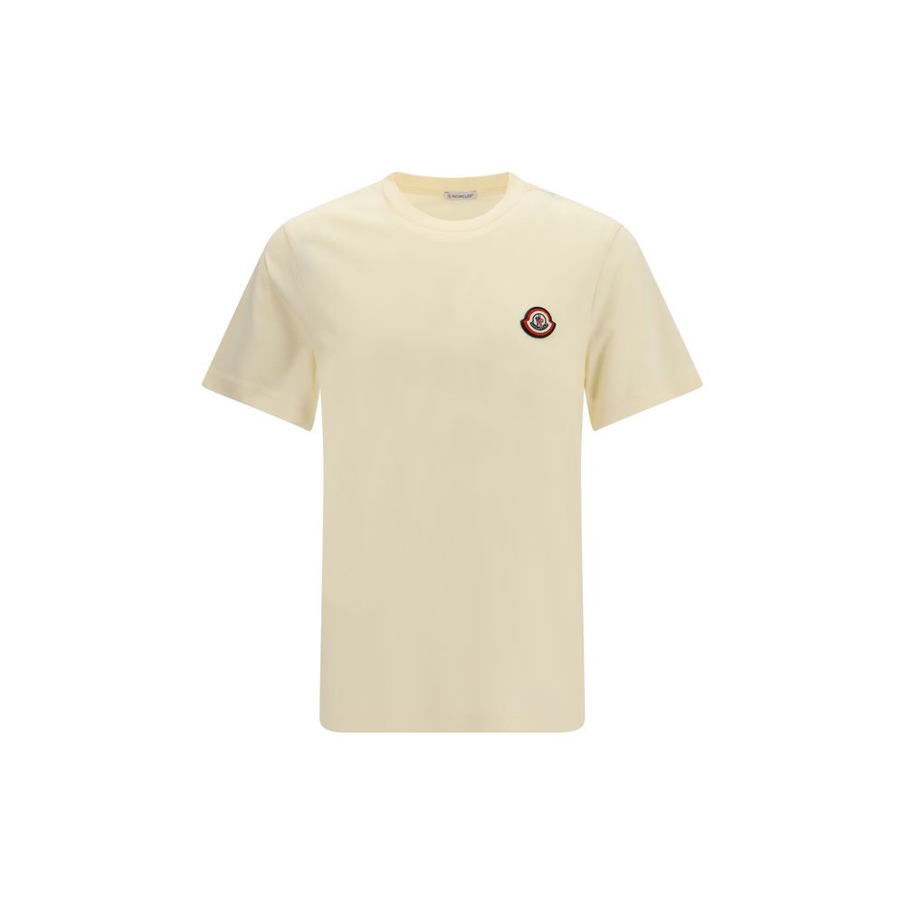 T-Shirt by Moncler for men in cotton beige showcases a unassuming silhouette, artfully detailed with a refined crew neckline and unassuming short-sleeve for a sophisticated, contemporary look.