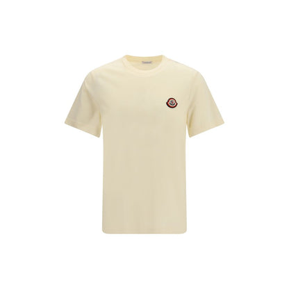 T-Shirt by Moncler for men in cotton beige showcases a unassuming silhouette, artfully detailed with a refined crew neckline and unassuming short-sleeve for a sophisticated, contemporary look.
