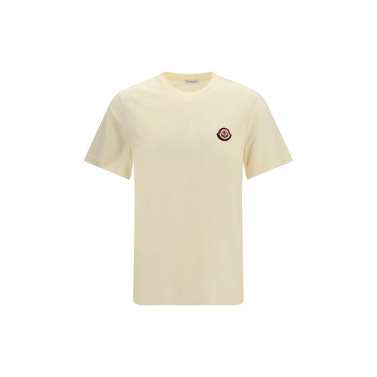 T-Shirt by Moncler for men in cotton beige showcases a unassuming silhouette, artfully detailed with a refined crew neckline and unassuming short-sleeve for a sophisticated, contemporary look.