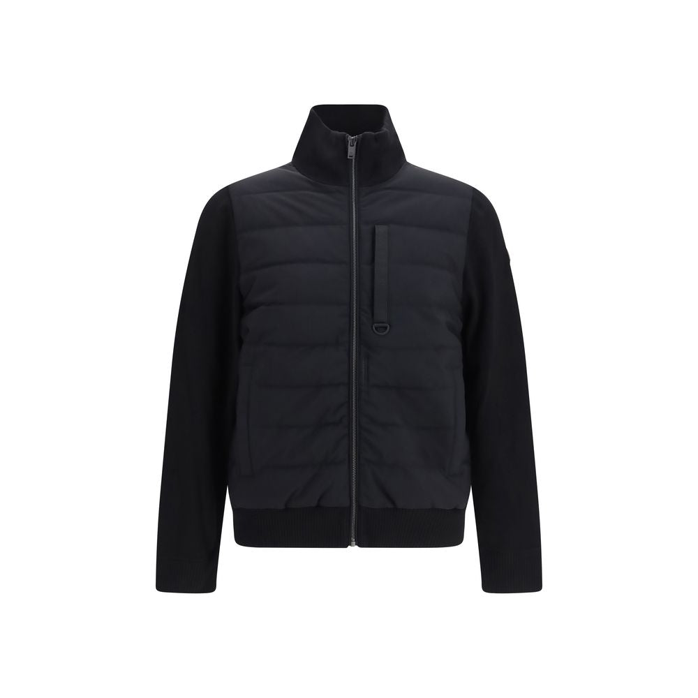 Puffer Jacket by Moose Knuckles for men in polyester & viscose black features an contemporary silhouette, showcasing a sophisticated high-collar neckline and contemporary pockets & insulated for a truly refined look.