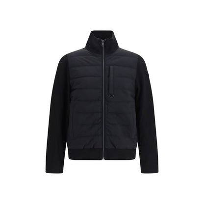 Puffer Jacket by Moose Knuckles for men in polyester & viscose black features an contemporary silhouette, showcasing a sophisticated high-collar neckline and contemporary pockets & insulated for a truly refined look.