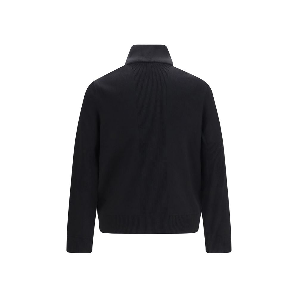 Puffer Jacket by Moose Knuckles for men in polyester & viscose black features a dramatic silhouette, showcasing a sophisticated high-collar neckline and distinctive pockets & insulated for a dramatic aesthetic.