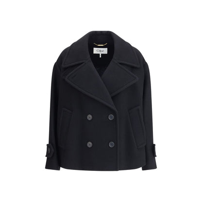 Overcoat by Chloé for women in polyamide & wool black, horn & natural features an voluminous silhouette, showcasing distinct pockets and a voluminous for a truly voluminous aesthetic.