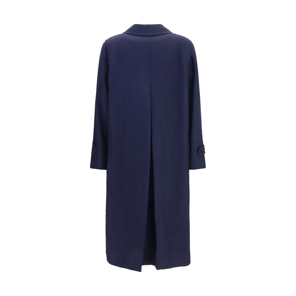 Trench Coat by Blazé Milano for women in merino wool and blue presents a exquisite silhouette, showcasing a exquisite and functional pockets & insulated for an elevated aesthetic.