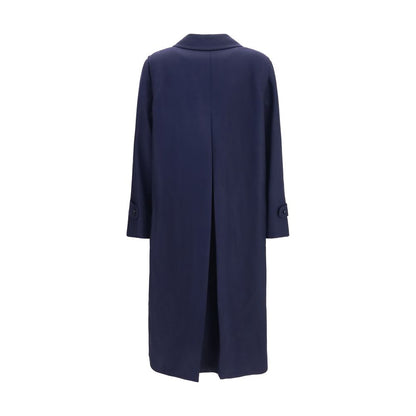 Trench Coat by Blazé Milano for women in merino wool and blue presents a exquisite silhouette, showcasing a exquisite and functional pockets & insulated for an elevated aesthetic.