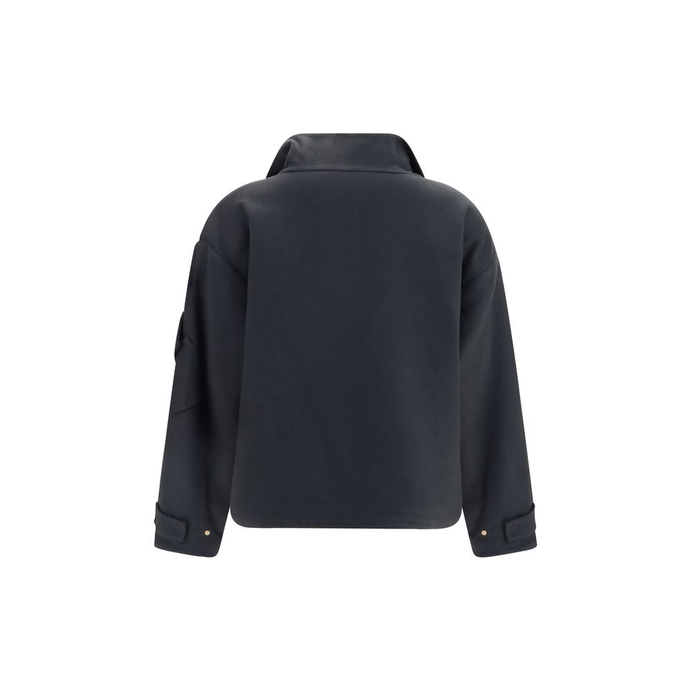 Overcoat by Giorgio Armani for women in cashmere & capra leather gray, gold & natural features an voluminous silhouette, showcasing distinct pockets and a voluminous high-collar neckline for a truly voluminous aesthetic.