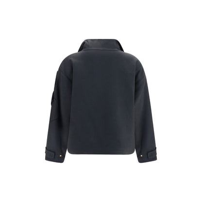 Overcoat by Giorgio Armani for women in cashmere & capra leather gray, gold & natural features an voluminous silhouette, showcasing distinct pockets and a voluminous high-collar neckline for a truly voluminous aesthetic.