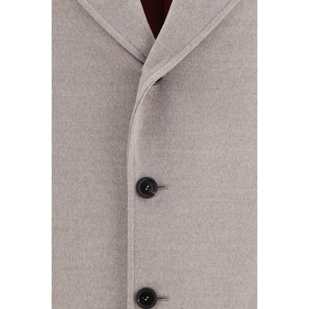 Overcoat by Brunello Cucinelli for men in virgin wool beige features an voluminous silhouette, showcasing distinct pockets and a voluminous for a truly voluminous aesthetic.