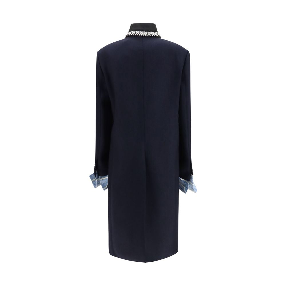 Overcoat by Prada for women in wool blue features an voluminous silhouette, showcasing distinct pockets and a voluminous single-breasted neckline for a truly voluminous aesthetic.