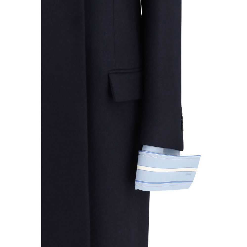 Overcoat by Prada for women in wool blue presents a luxurious silhouette, showcasing a luxurious and sophisticated pockets for a premium, luxurious look.
