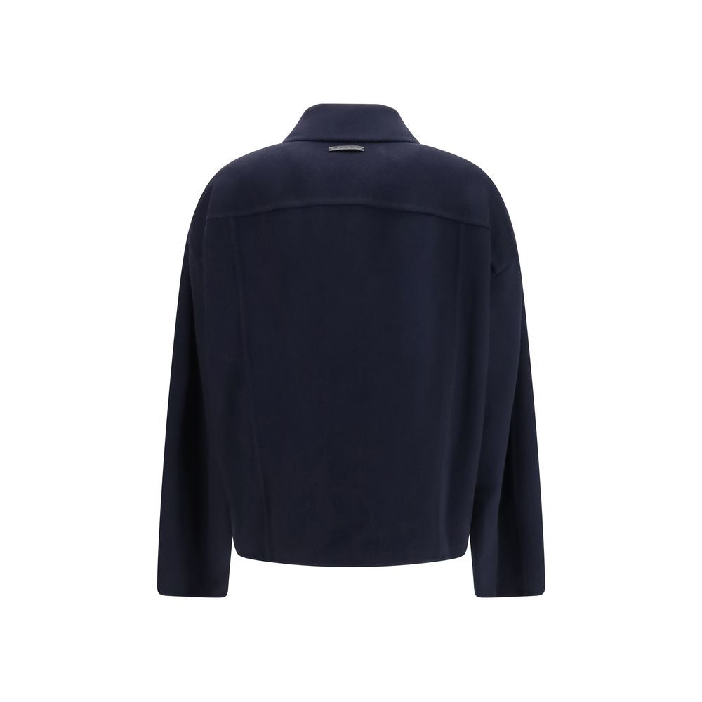 Jacket by Marni for women in wool blue presents a impeccable silhouette, showcasing distinct pockets and a impeccable for a sophisticated finish.