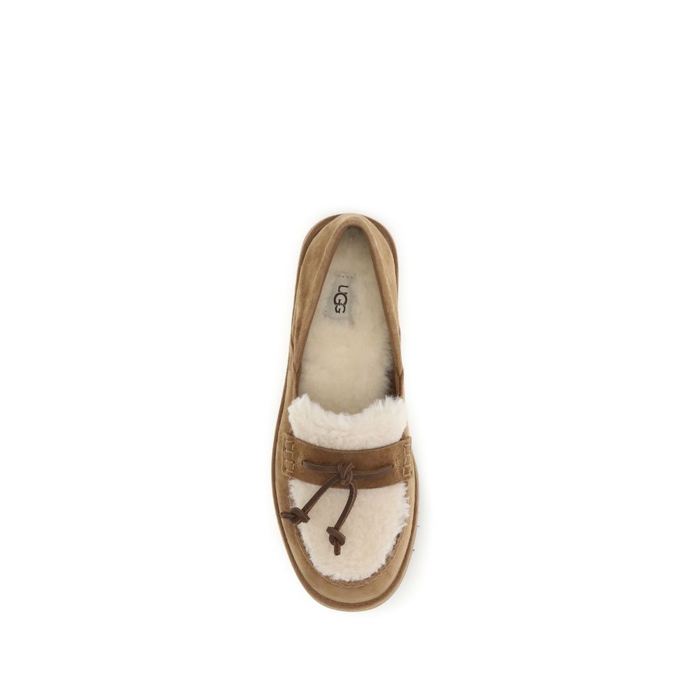 Flat Loafer Slip-On Shoes by UGG for women in eva suede leather & wool beige showcases a resplendent Women's EVA Suede Leather & Wool Flat Loafer Slip-On Shoes aesthetic, defined by its resplendent and elegant flat.