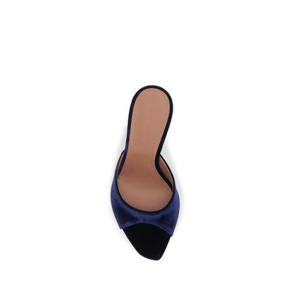 Stiletto Sandals by Amina Muaddi for women in velvet and blue presents a captivating silhouette, showcasing the signature style of the Women's Velvet Stiletto Sandals with a captivating stiletto and captivating almond toe style.