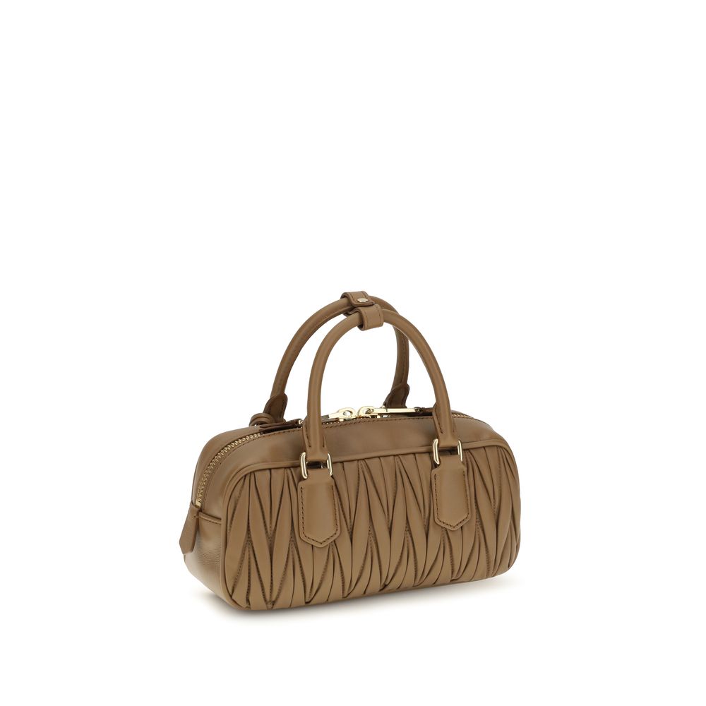 This Shoulder Handbag by Miu Miu for women in bos taurus calf leather and beige, signature & monogram presents a sculptural silhouette featuring a secure zipper, ample single-compartment, and versatile shoulder-strap, adjustable-strap & handle for a sculptural finish.