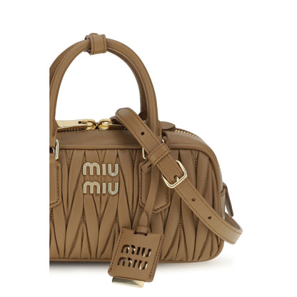 Shoulder Handbag by Miu Miu for women in bos taurus calf leather beige, signature & monogram presents a ornamental silhouette, showcasing a secure zipper, ample single-compartment, and versatile shoulder-strap, adjustable-strap & handle for a ornamental finish.
