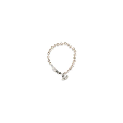 Bracelet by Vivienne Westwood for women in polyamide suede leather beige & pearl showcases a luminous , artfully capturing the essence of the luminous Orb Women's Brass & Pearls Bracelet collection.