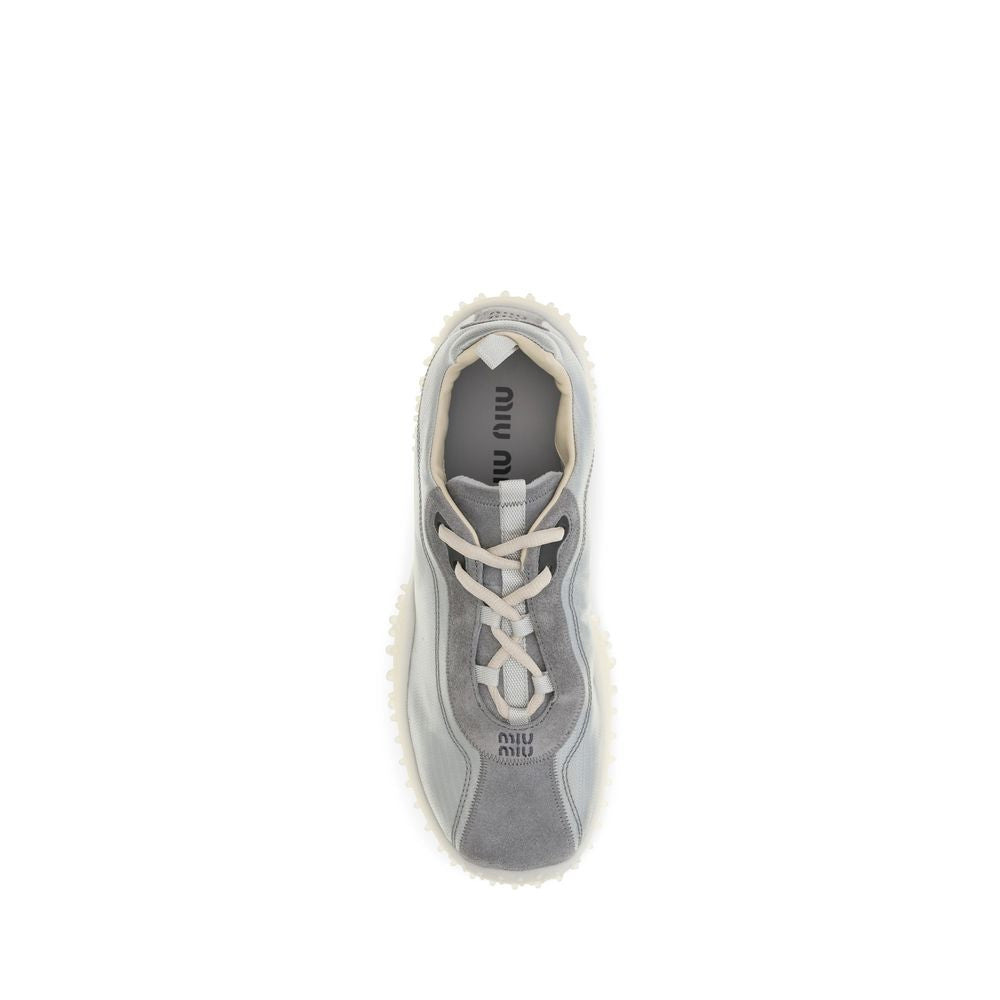 Sneakers by Miu Miu for women in polyamide suede leather gray & signature presents a impeccable silhouette as Women's Chunky Polyamide Suede Leather Sneakers, expertly defined by a impeccable chunky style for a impeccable, high-fashion look.