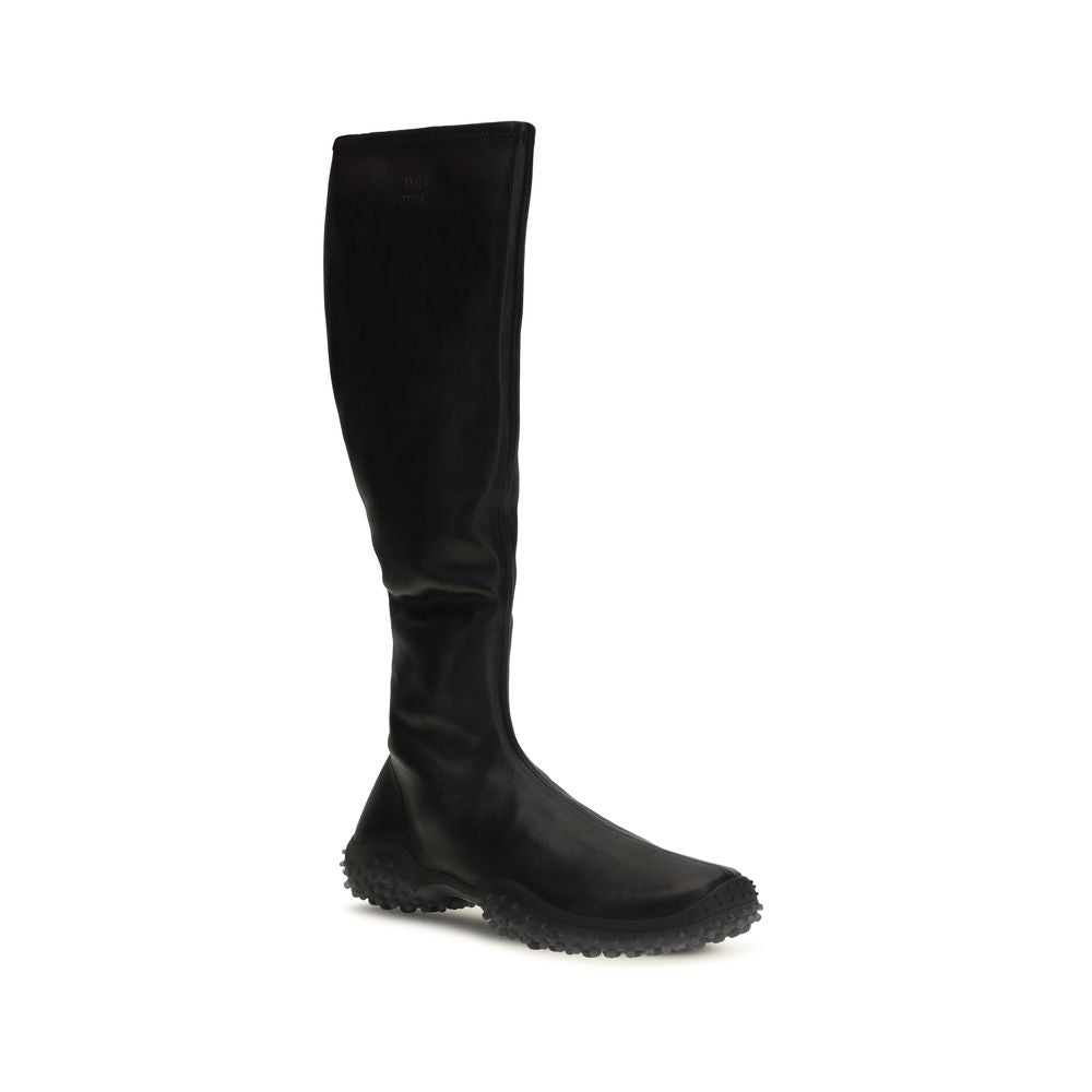 Ankle Boots by Miu Miu for women in nappa leather & rubber black showcases a ergonomic silhouette from the Women's Nappa Leather & Rubber Ankle Boots collection, featuring a ergonomic and a ergonomic .