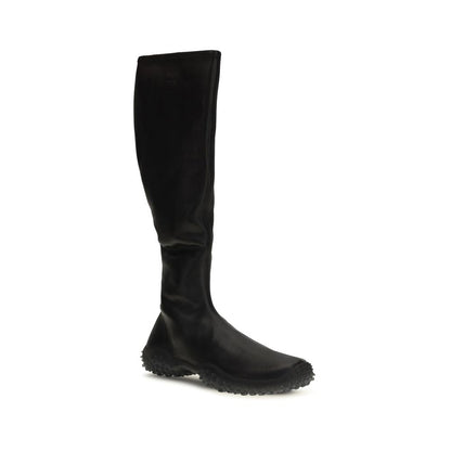 Ankle Boots by Miu Miu for women in nappa leather & rubber black showcases a ergonomic silhouette from the Women's Nappa Leather & Rubber Ankle Boots collection, featuring a ergonomic and a ergonomic .