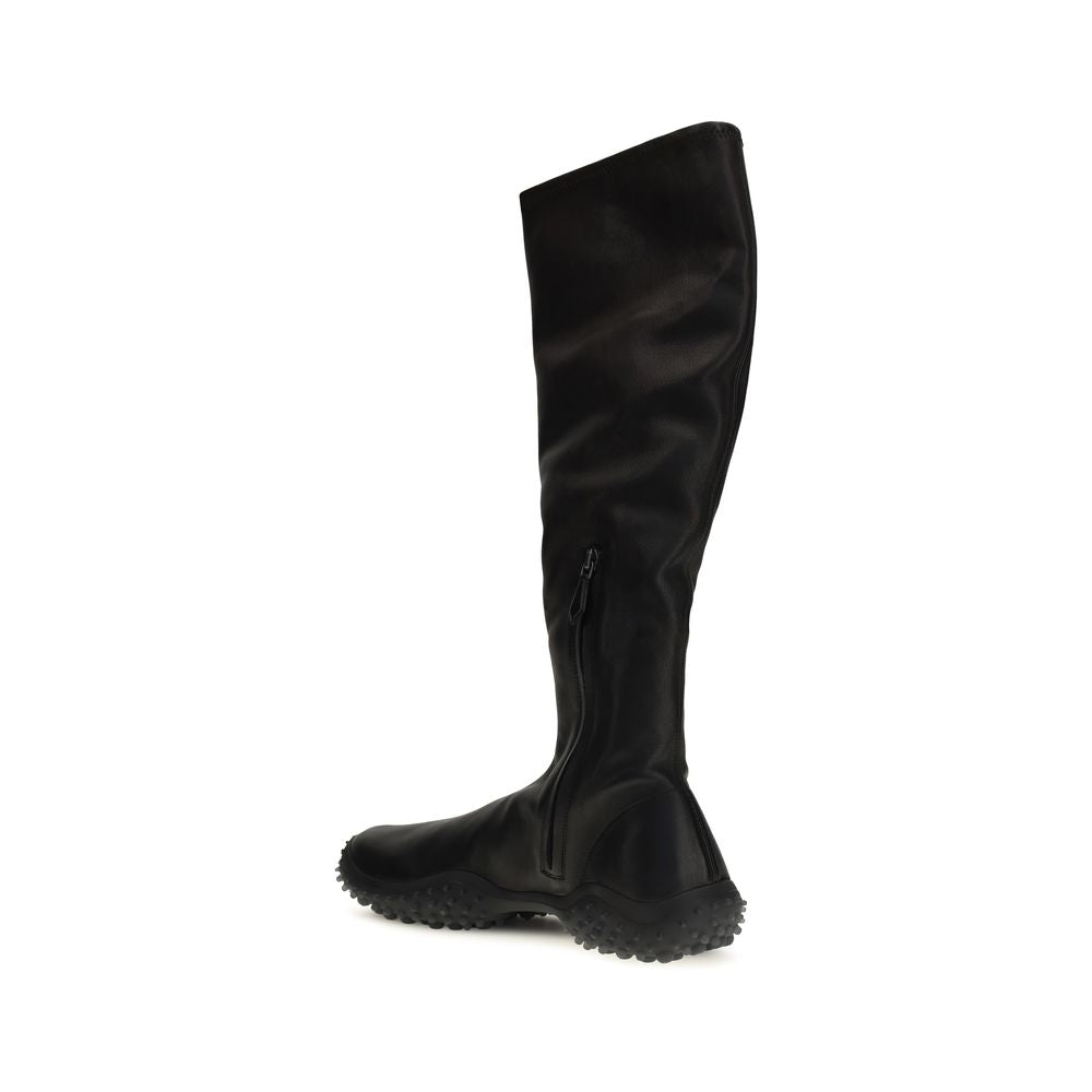 Ankle Boots by Miu Miu for women in nappa leather & rubber black features an enchanting design from the Women's Nappa Leather & Rubber Ankle Boots collection, highlighting a enchanting and for a refined look.
