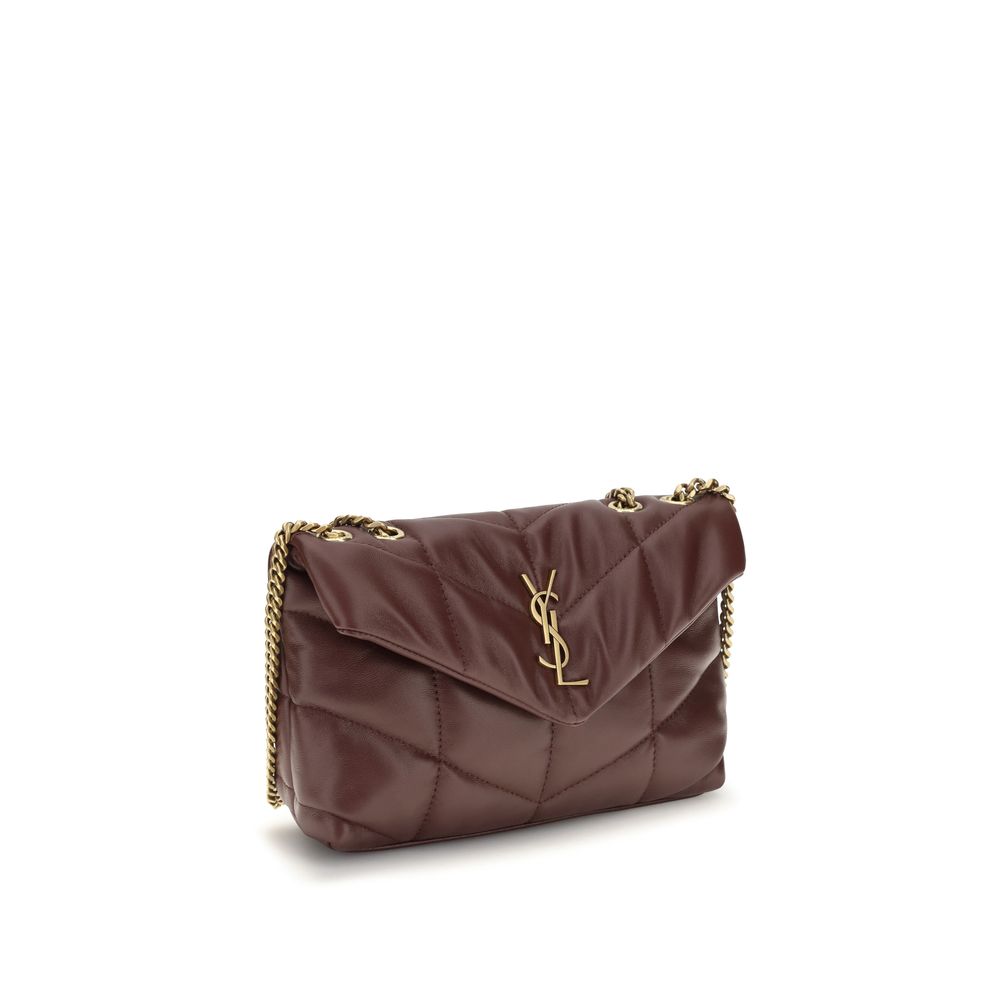 Compact Shoulder Flap Bag by Saint Laurent for women in lambskin leather bordeaux features a effortless chic silhouette with a secure flap & magnetic, ample , and versatile shoulder-strap for a effortless chic finish.