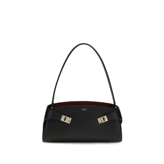 East West Shoulder Bag by Ferragamo for women in bos taurus calf leather black, gold & signature features a effortless sophistication silhouette, secured by a zipper & buckle with ample and versatile shoulder-strap for a effortless sophistication finish.