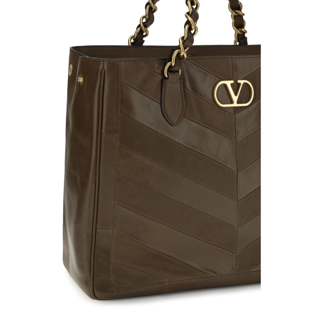 Shoulder Shopper Bag by Valentino Garavani for women in bos taurus nappa calf leather brown, gold, patterned, chevron, signature & patchwork features a effortless sophistication silhouette, secured by a magnetic with ample and versatile shoulder-strap & handle for a effortless sophistication finish.